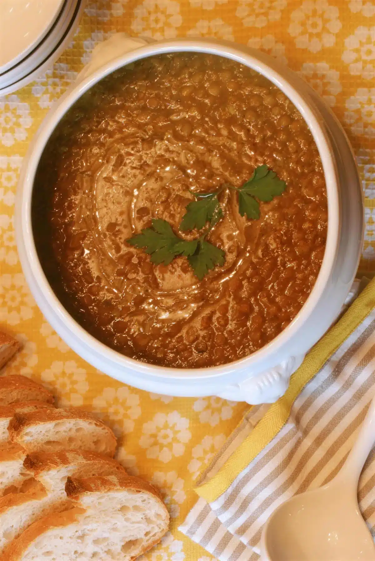 Overhead curry lentil soup topped with flat-leaf parsley