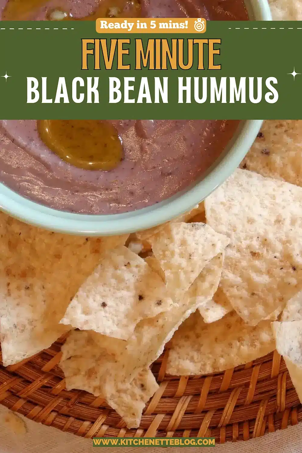 Bowl of smooth dark spread drizzled with oil beside tortilla chips