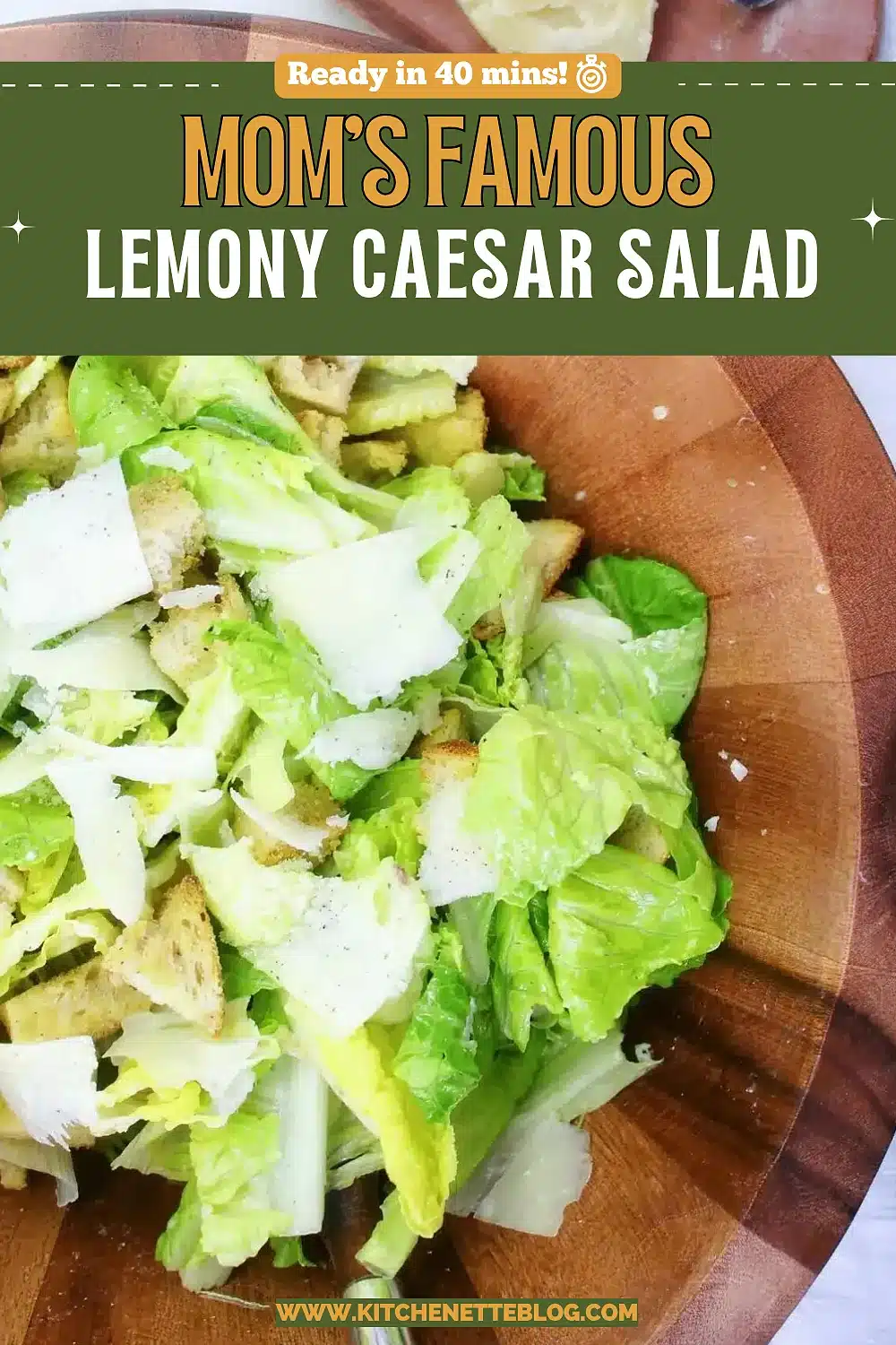 Crisp romaine tossed with garlic croutons and shaved parmesan in a wooden bowl