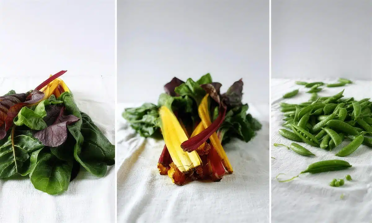 Rainbow chard leaves with red and yellow stems, and the ribs sliced thin