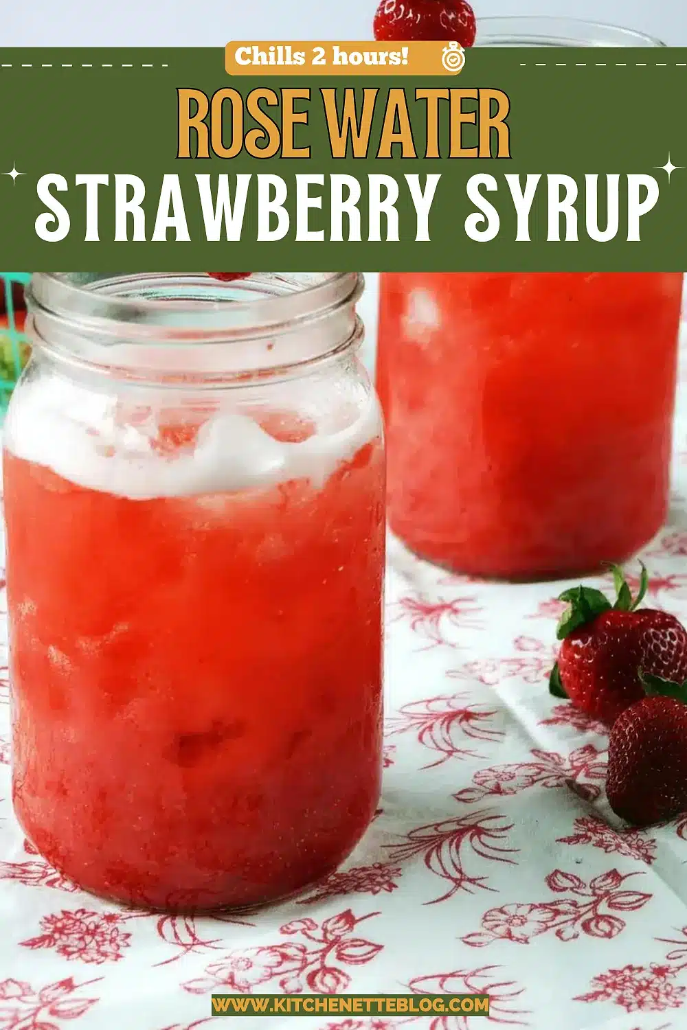 Two jars of a bright pink iced drink with fresh fruit on a floral cloth