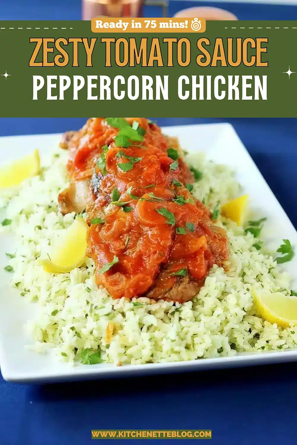 Saucy poultry pieces over herbed couscous with lemon wedges on a white platter