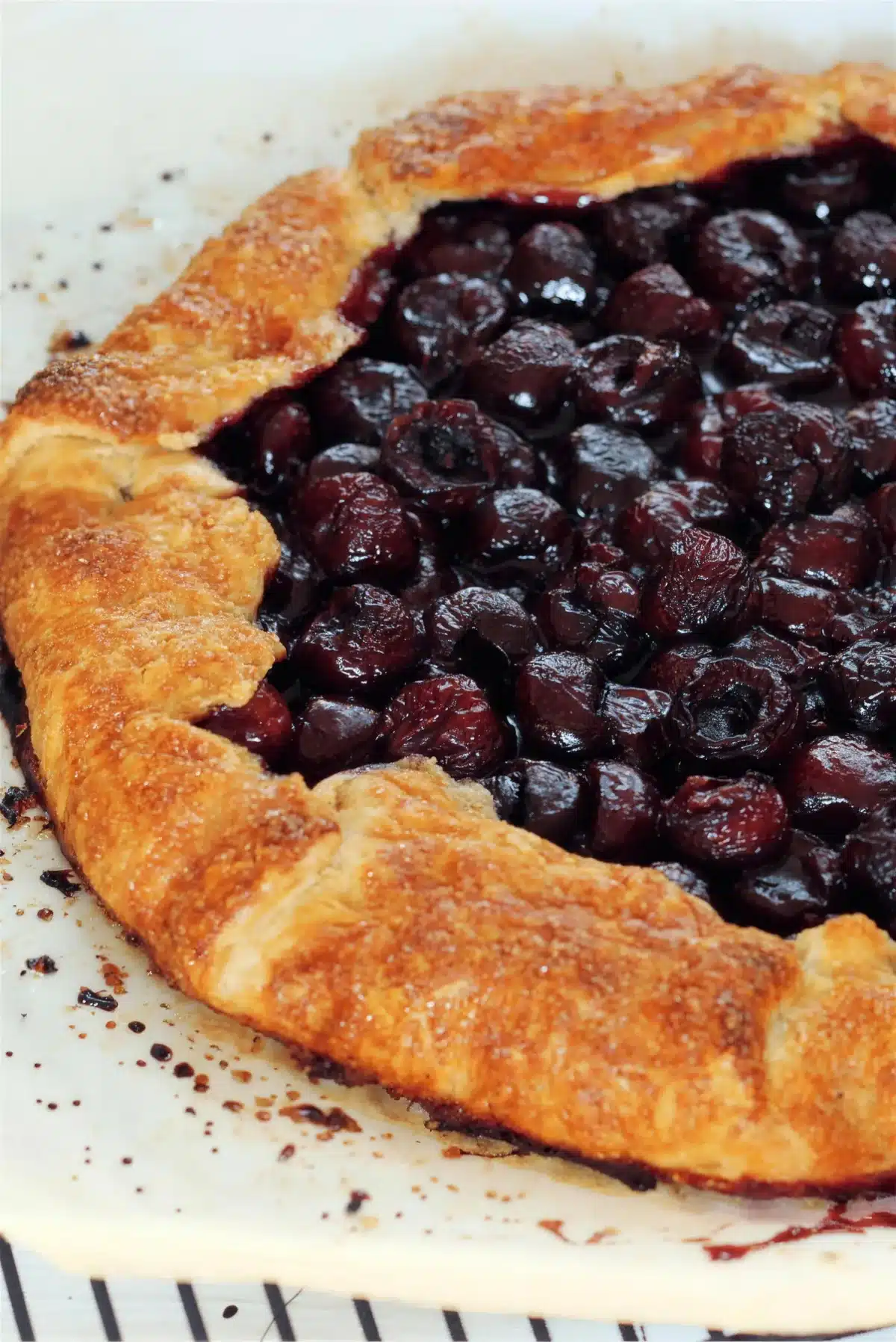 Cherry galette straight from the oven with the juices bubbling at the center