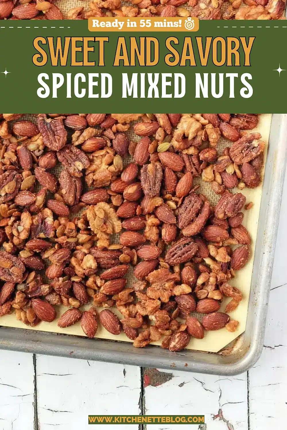 Tray of glossy roasted almonds, pecans and cashews in a blue dish