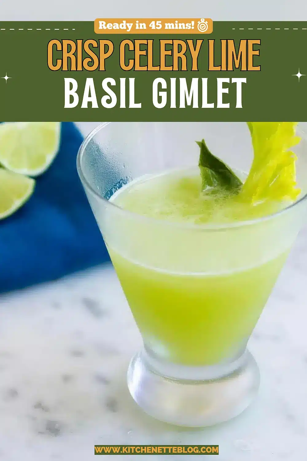 Pale cocktail in a footed glass with a leafy celery garnish and lime wedges