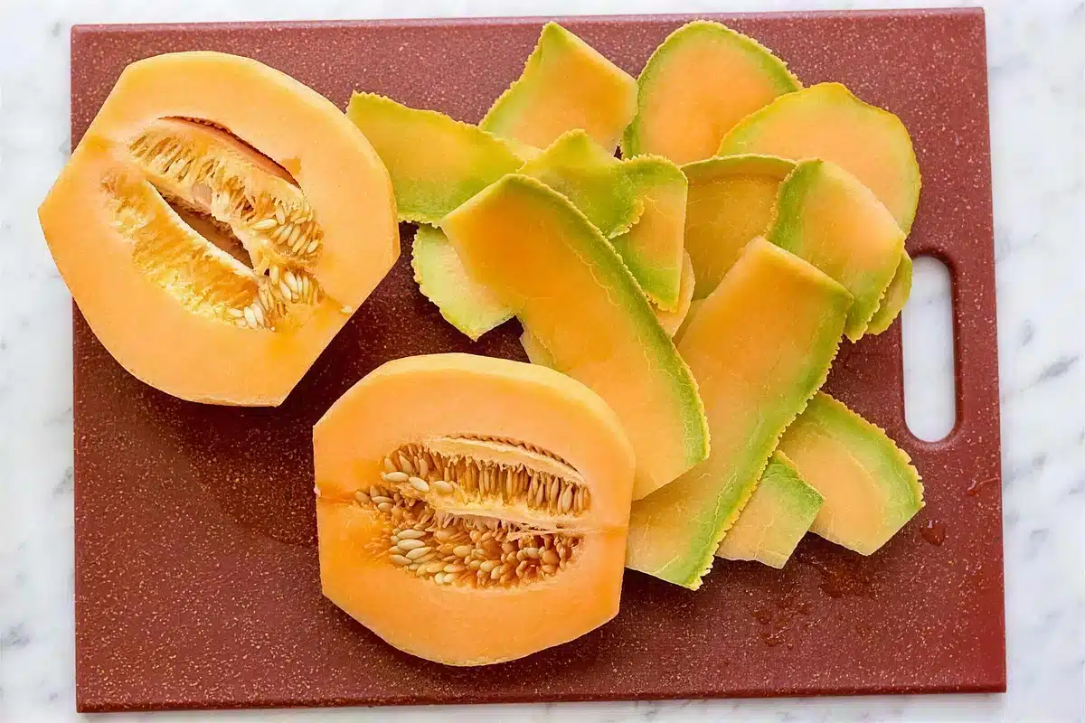 Cantaloupe halves and peeled slices ready for the strawberry sorbet base
