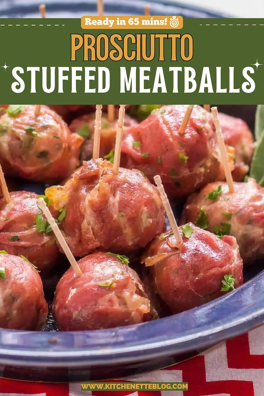 Prosciutto wrapped meatballs speared with wooden cocktail picks, heaped on a cobalt blue platter with sage and chopped parsley