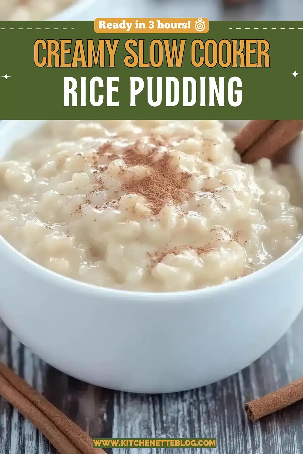 Creamy cinnamon dusted dessert in a white bowl beside cinnamon sticks