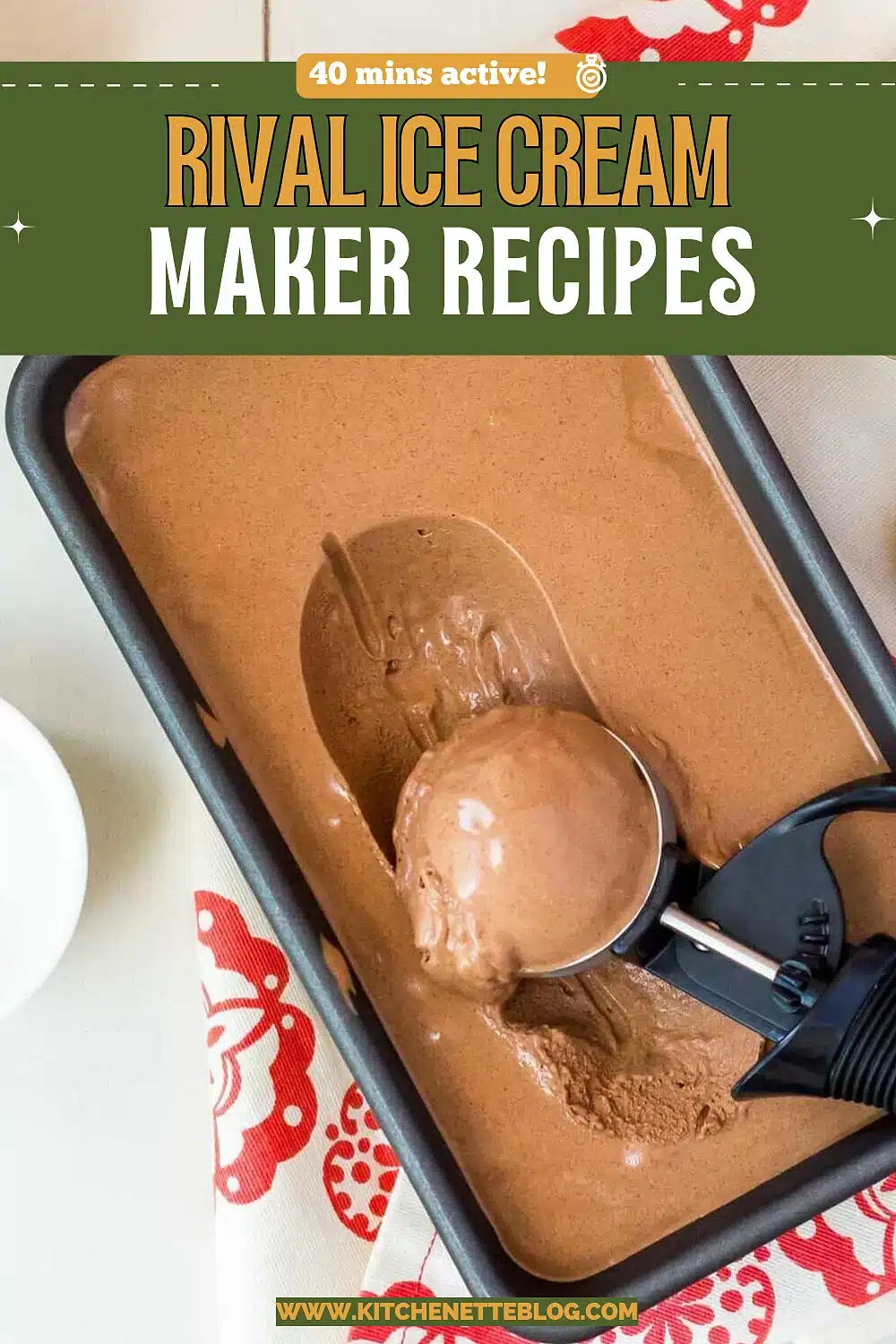 Chocolate ice cream in a metal loaf tin with a scoop resting in the surface