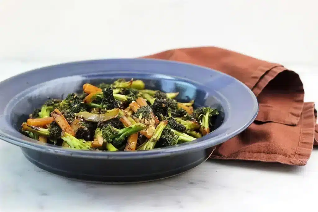Glazed green florets and stem matchsticks in a blue ceramic bowl