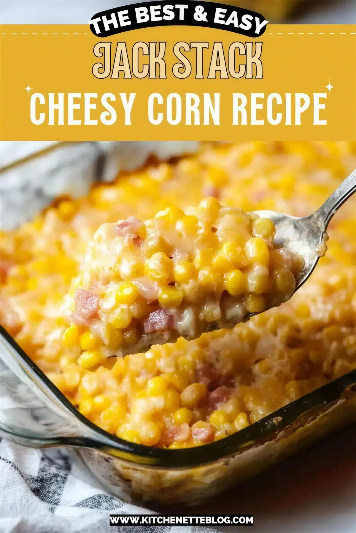Spoon lifting creamy cheesy corn with ham from a glass baking dish