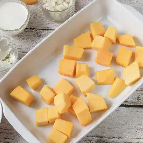 Butternut cubes arranged in one layer ready for the oven