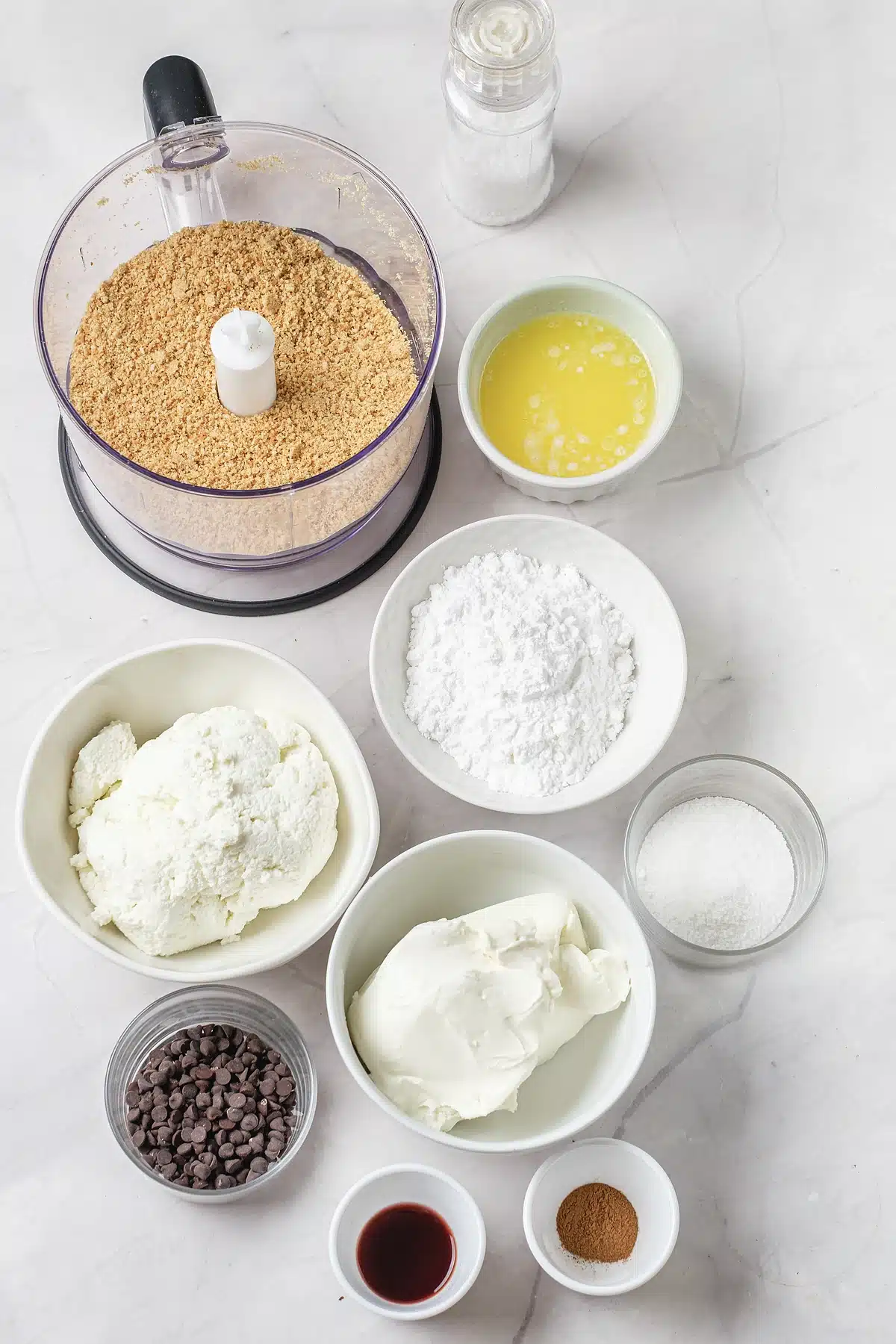 Ricotta, mascarpone and mini chocolate chips laid out for cannoli pie