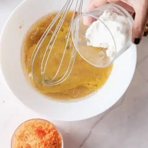 The dry ingredients tipped into the whisked wet mixture