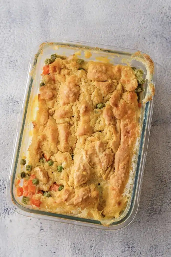 Red Lobster chicken cobbler in a glass dish seen from directly above, the biscuit top golden and cracked