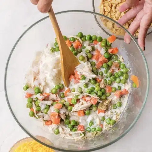 The filling stirred together with a wooden spoon in a glass bowl