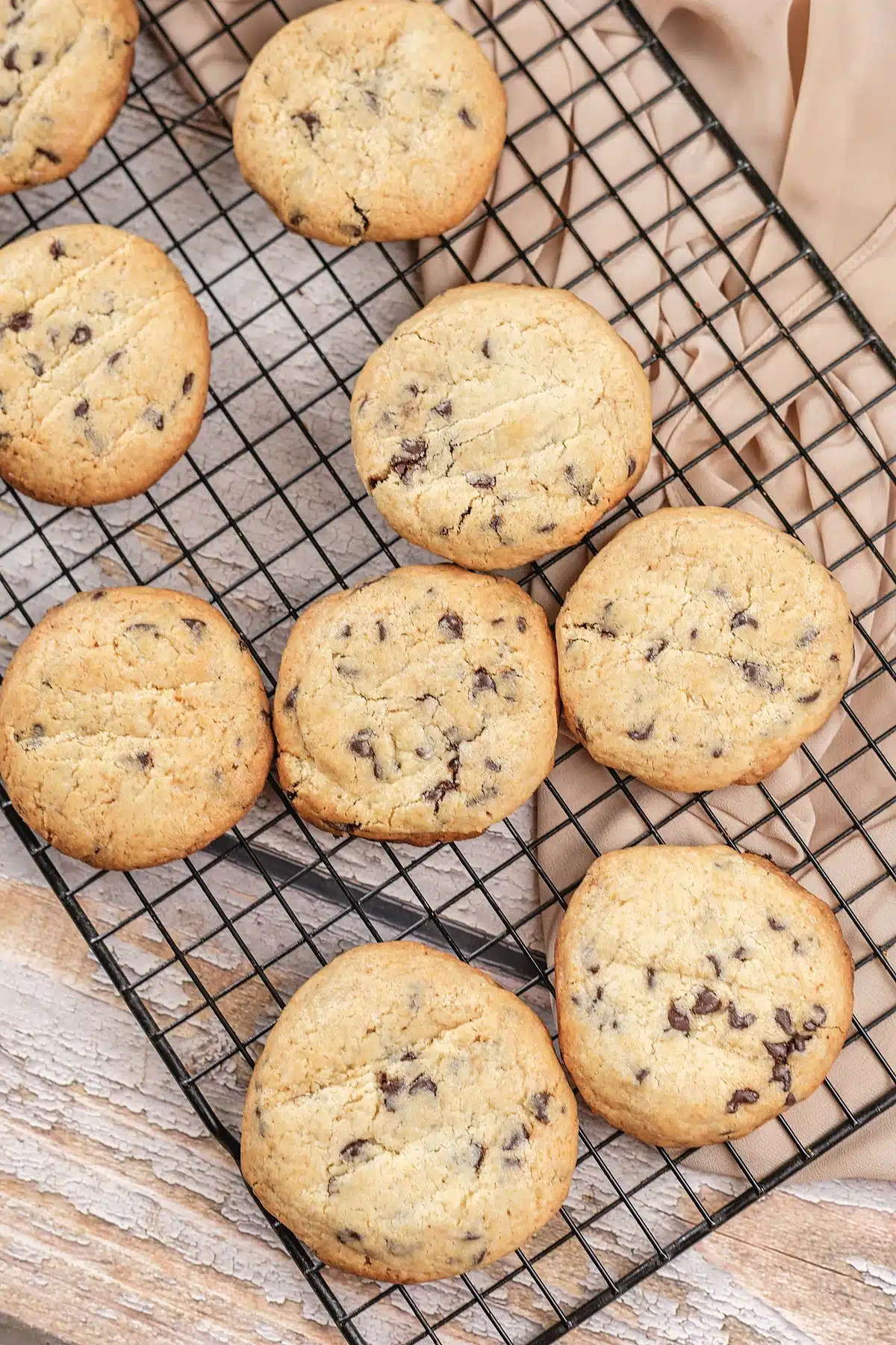 A close overhead view of thick golden rounds on a black cooling rack