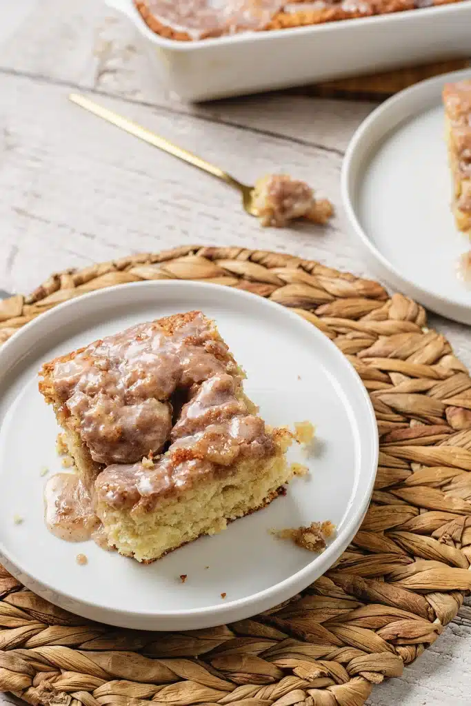 Cinnamon roll coffee cake seen from directly above on a white plate