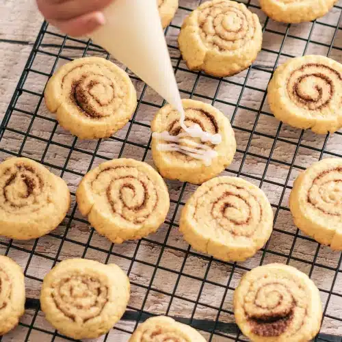 White glaze piped in lines over the spirals on the rack