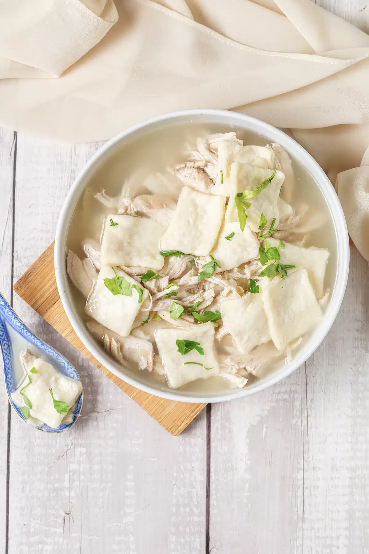 Cracker Barrel chicken and dumplings seen from above in a white bowl