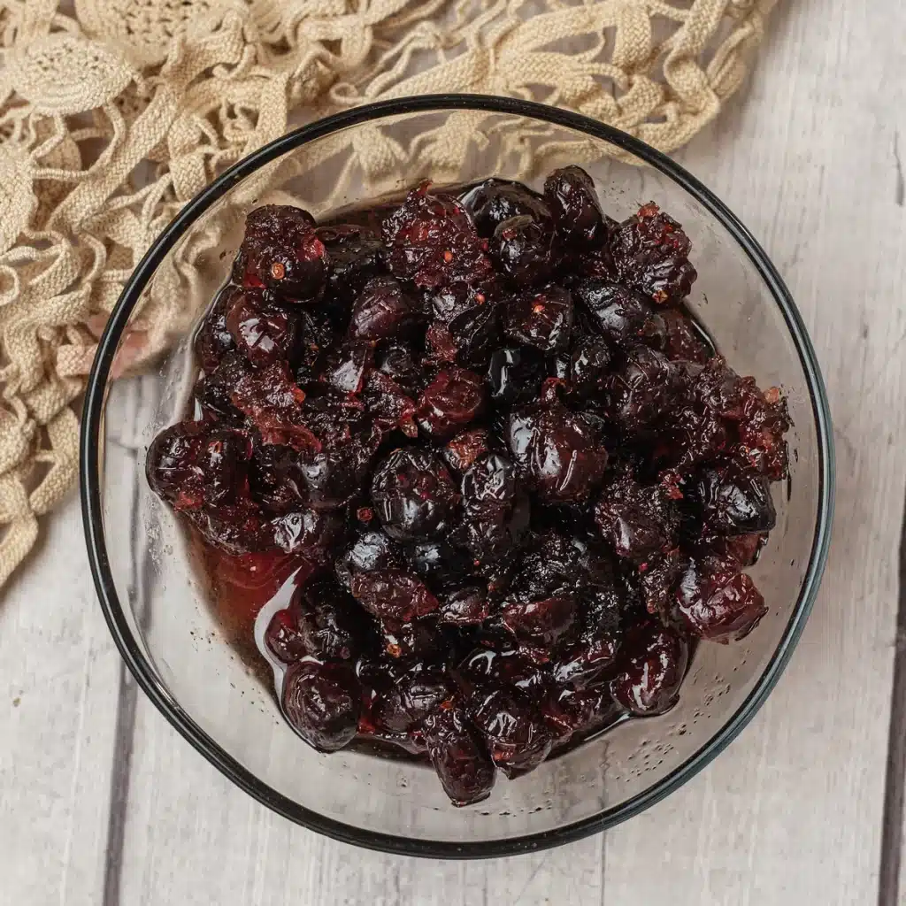 Cranberry sauce, dried cranberry version, in a glass bowl seen from directly above