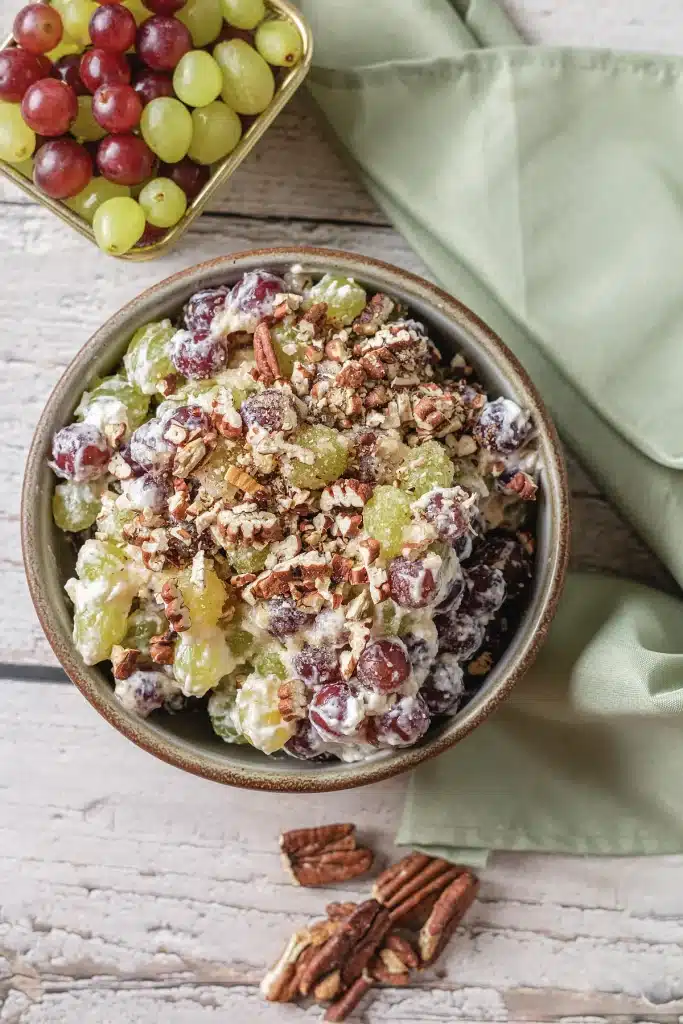 Grape salad seen from directly above in a speckled stoneware bowl