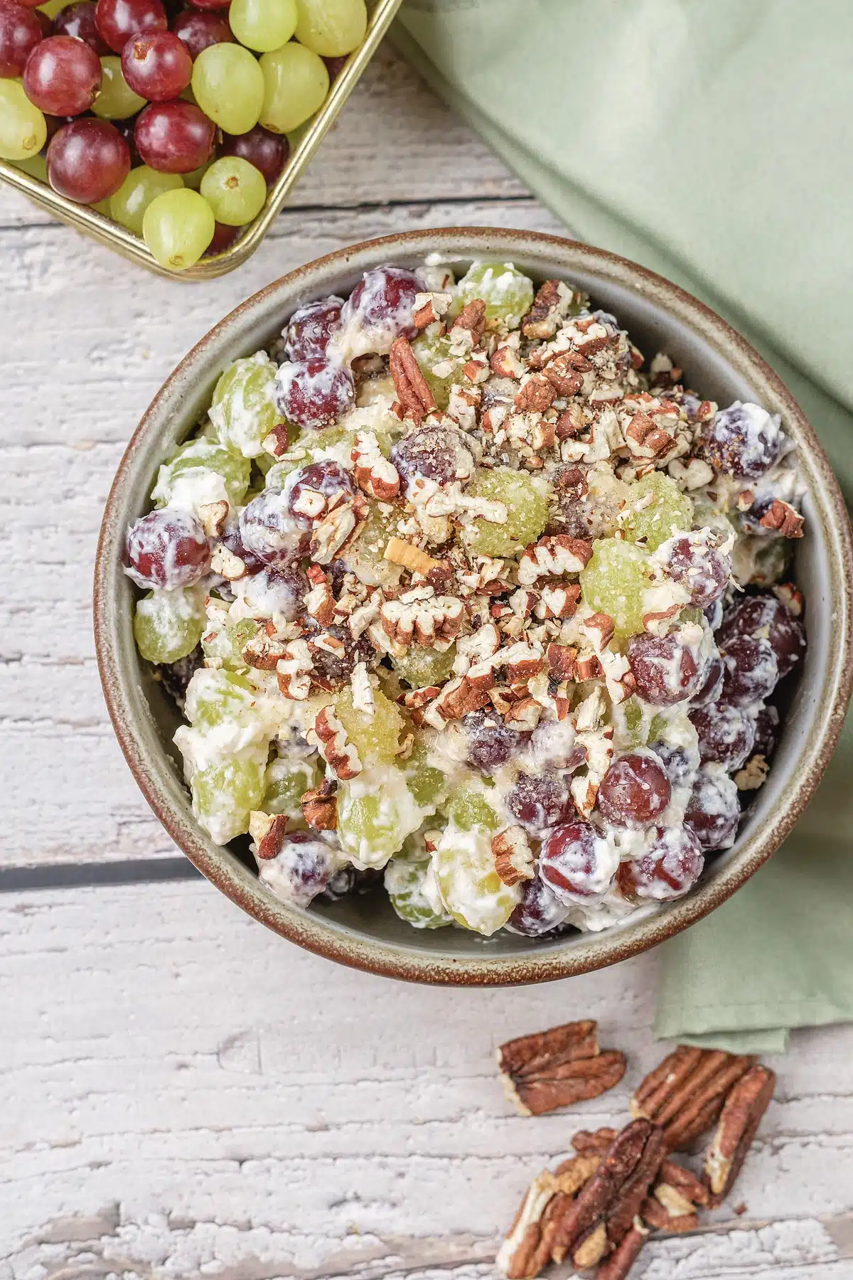 Grape salad seen up close with chopped pecans across the top