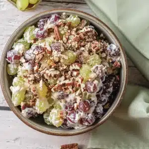 A single serving of grape salad in a small stoneware bowl