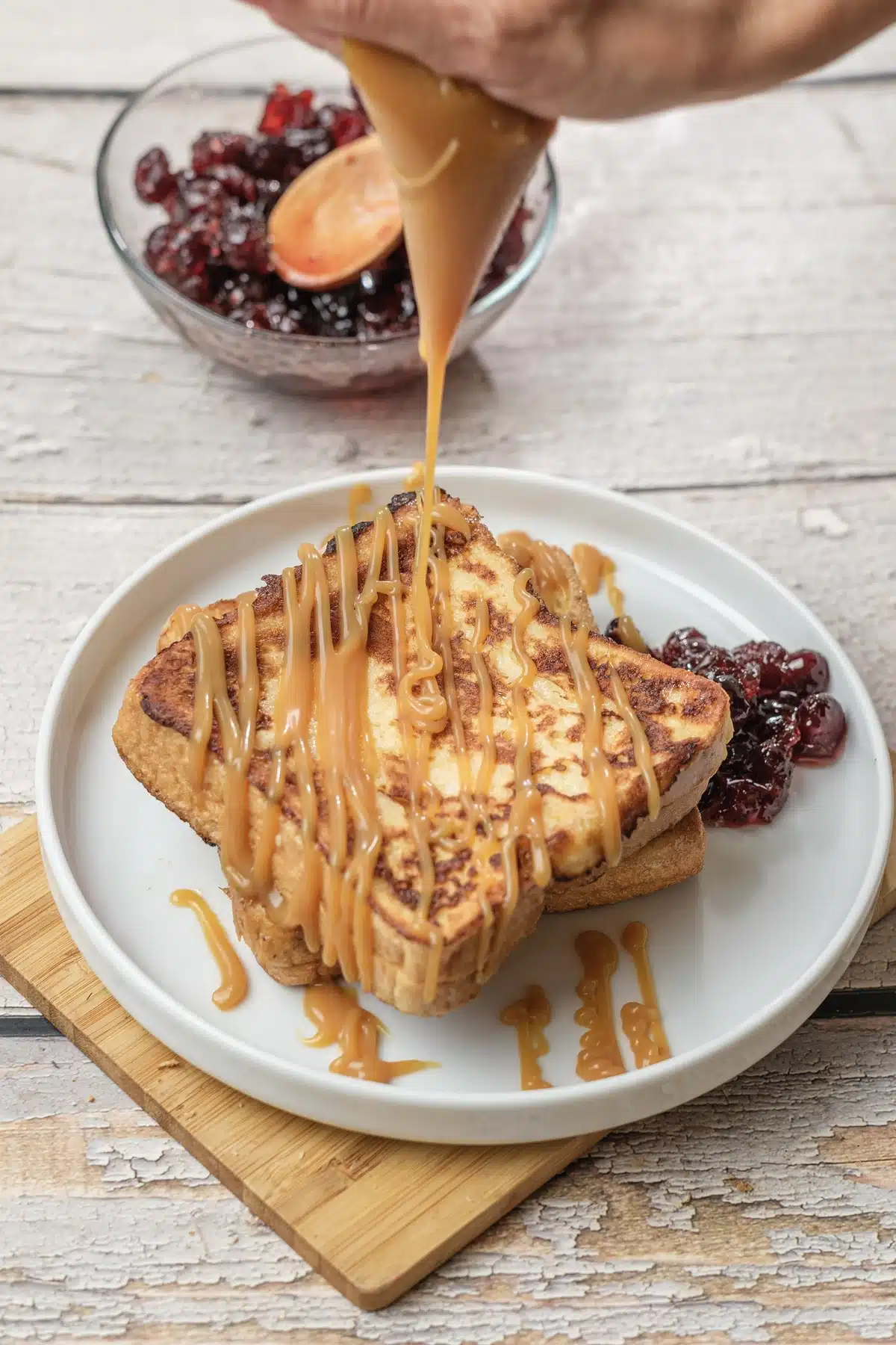 IHOP French toast copycat stack with caramel sauce being poured over the top slice
