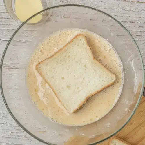 A thick slice of white bread dipped into the batter