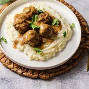 One plate of IKEA Swedish meatballs and gravy over mashed potato