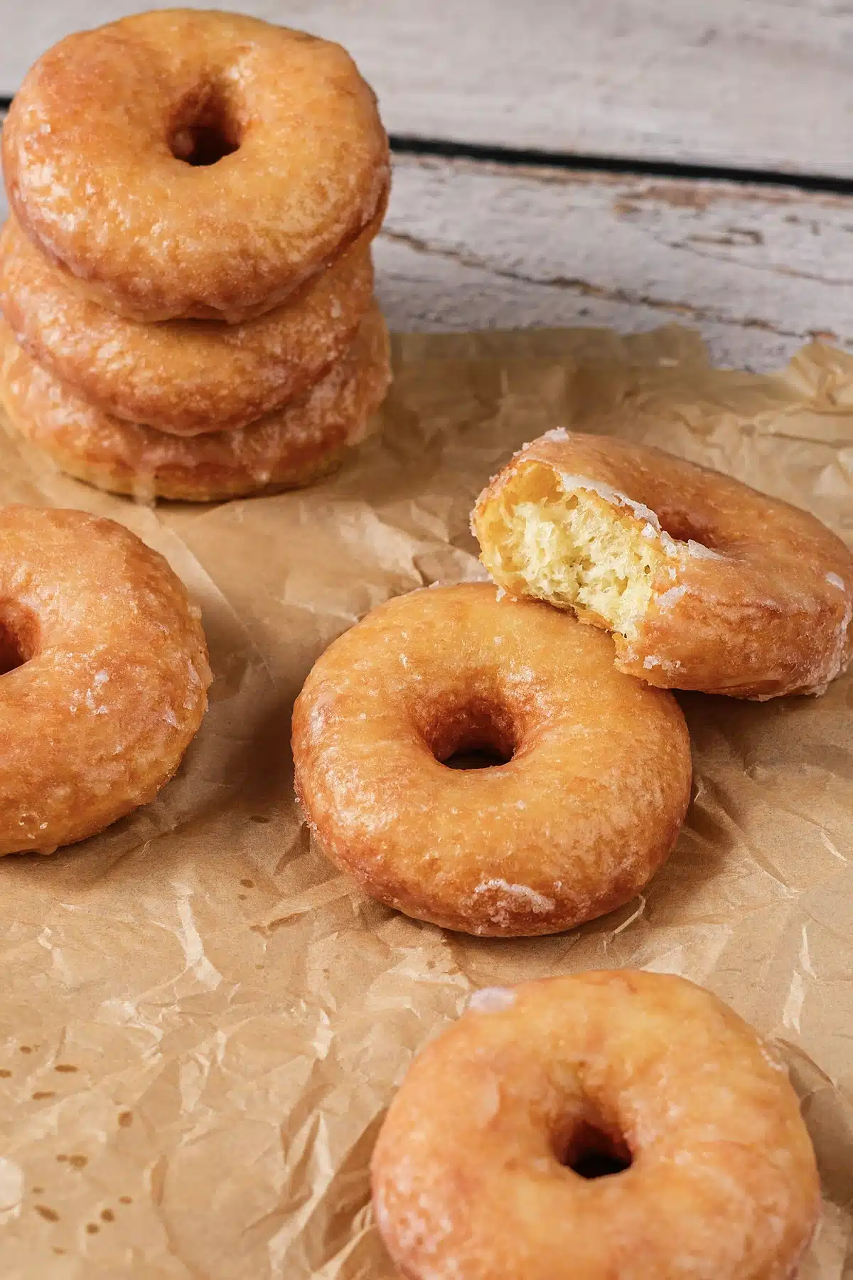A stack beside one broken open to show the soft, airy crumb inside