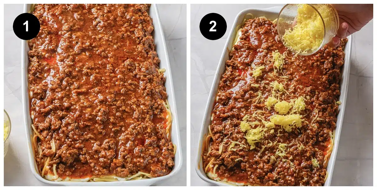 Two steps: meat sauce spread over the noodles, then shredded cheese poured on