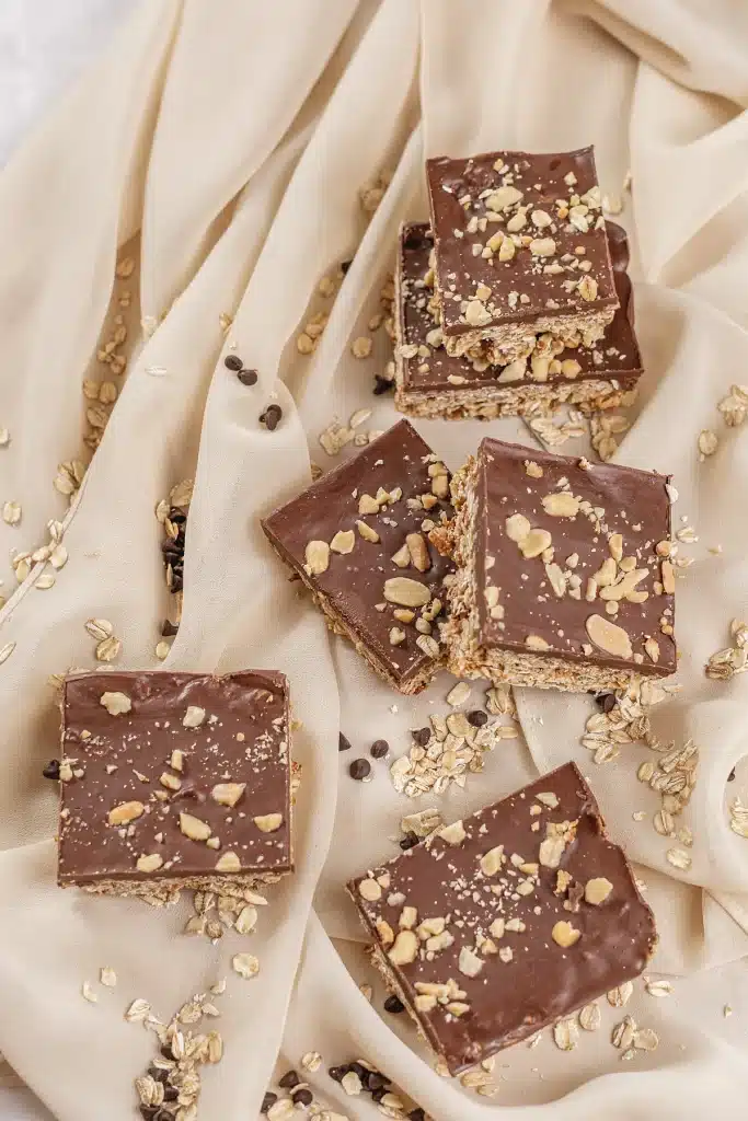 Oh Henry bars spread across cream fabric and seen from directly above