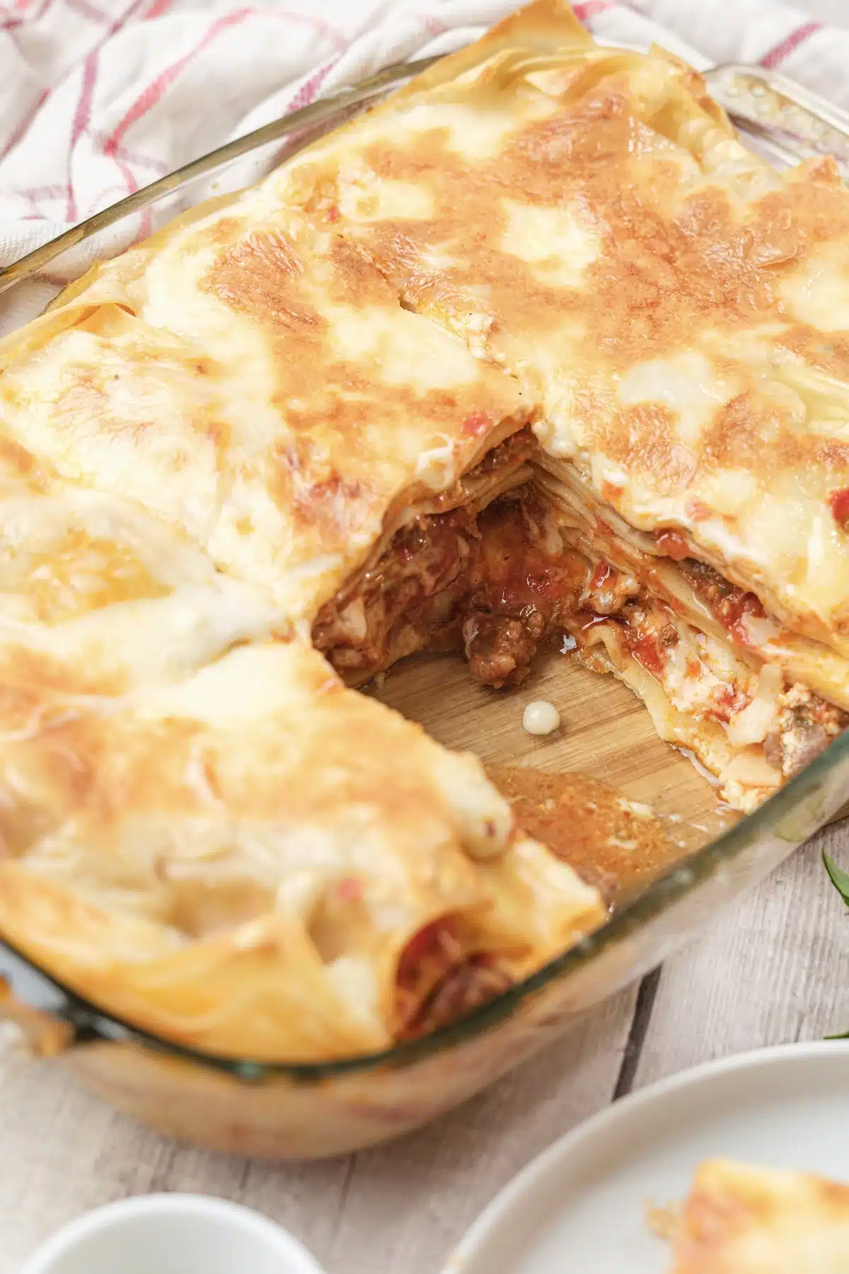 Olive Garden lasagna cut open to show the meat sauce and ricotta layers inside the dish