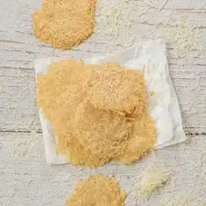 A small stack of Parmesan crisps on a paper towel