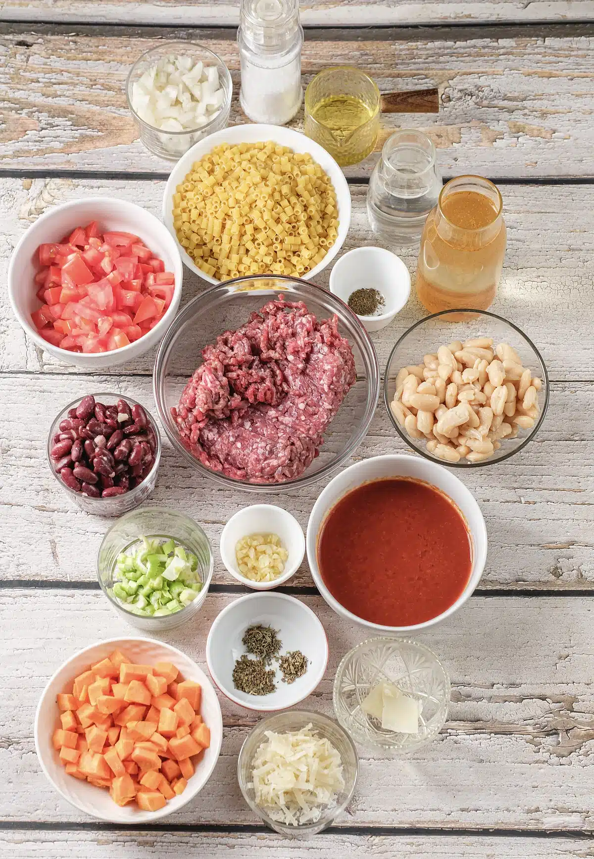 Ground beef, two kinds of beans, ditalini and diced tomatoes laid out for pasta fagioli