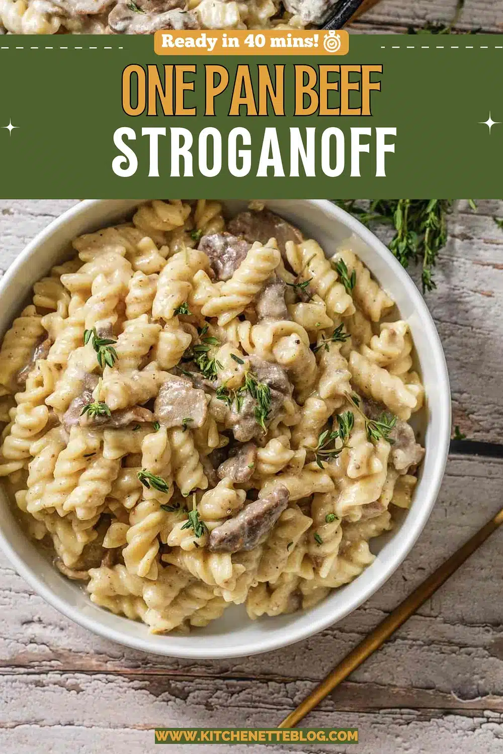 A white bowl of creamy twisted pasta with thyme and a gold fork beside it