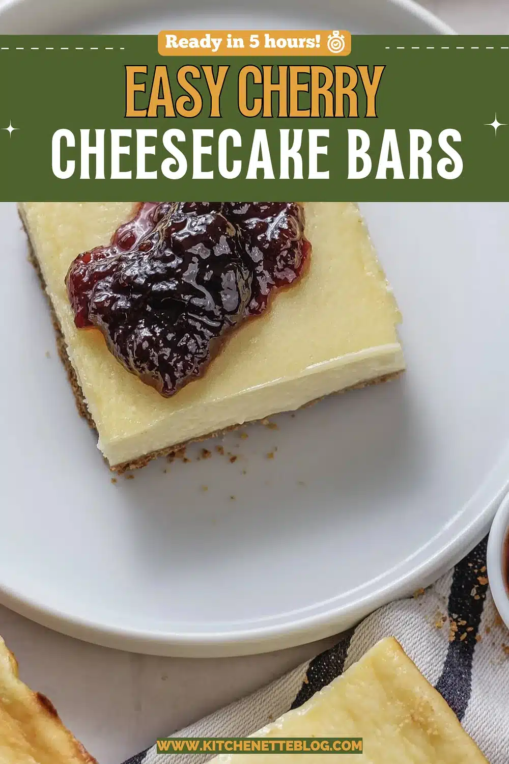 A chilled cream cheese square topped with dark fruit preserve on a white plate