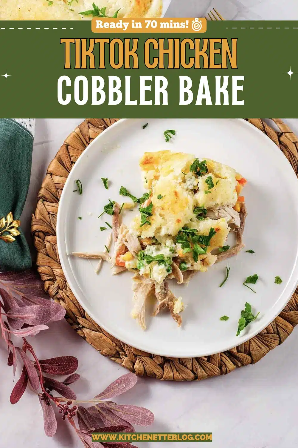A white plate holding a scoop of creamy poultry bake with herbs
