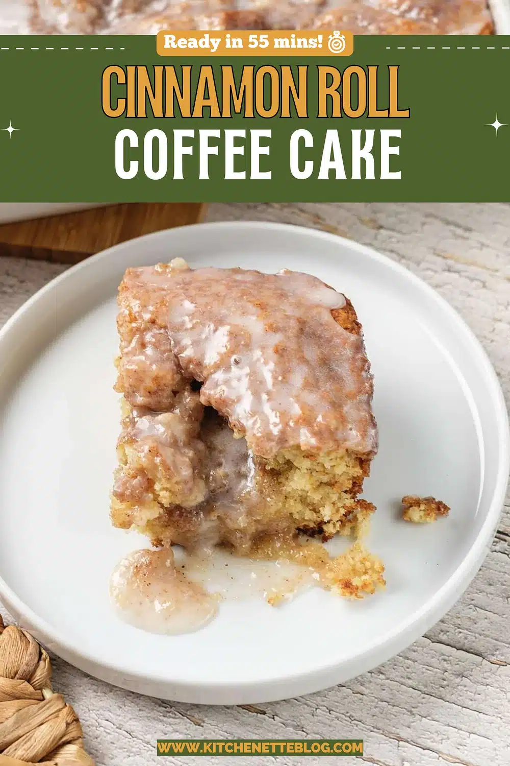 Glazed square of swirled breakfast cake on a small white plate