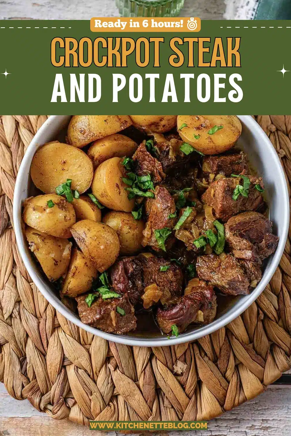 White bowl of tender beef chunks and golden root vegetables on a woven mat