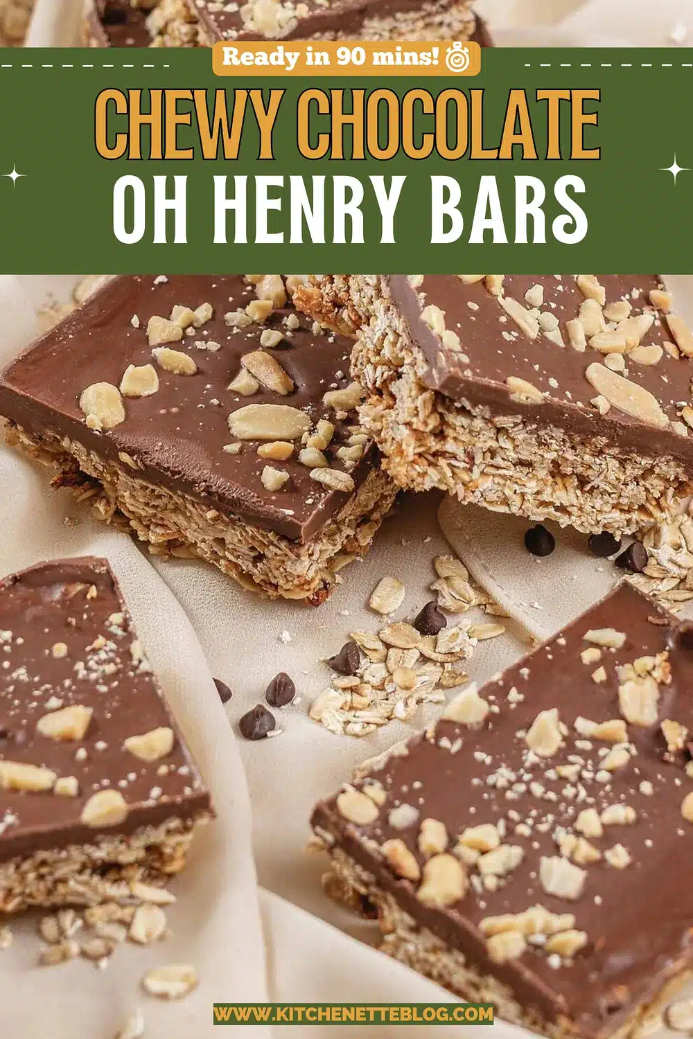 Stacked chocolate topped oat squares scattered with peanuts on cream fabric