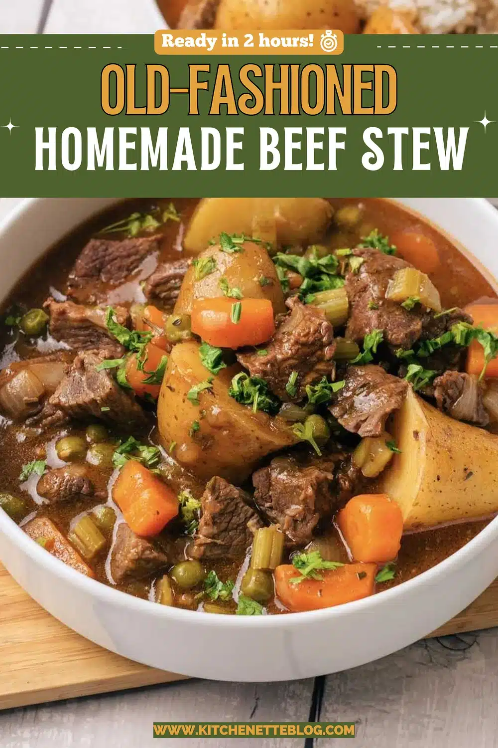 A white bowl of chunky meat and vegetable gravy with potatoes, carrots and peas on a wooden board