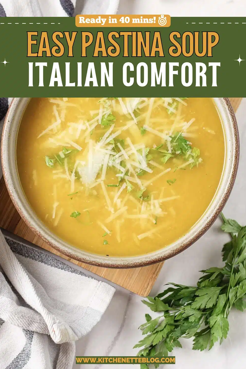 Stoneware bowl of golden broth with tiny star pasta and grated cheese
