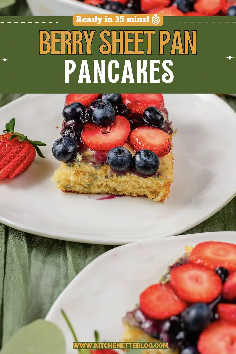 Berry topped squares on white plates with a sage linen runner