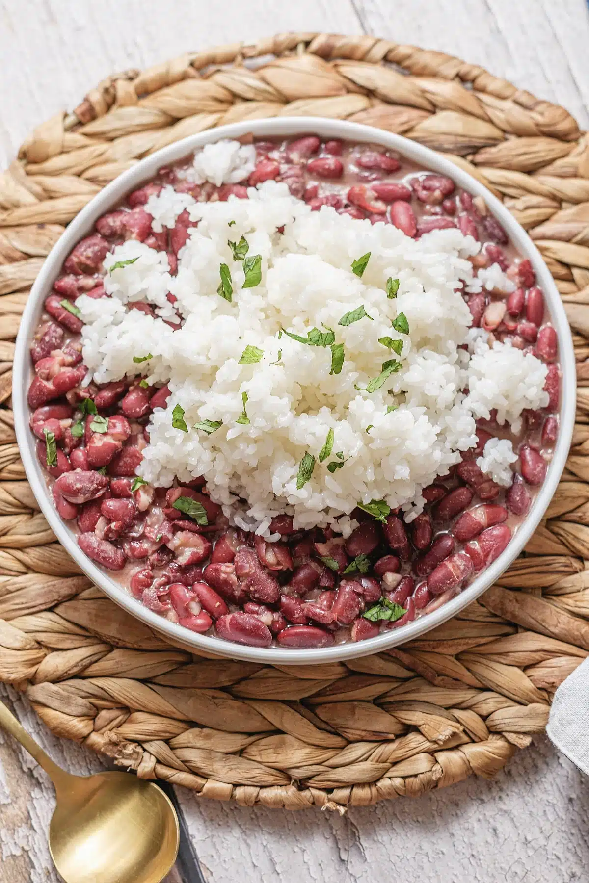 Red beans and rice seen up close with chopped parsley over the top