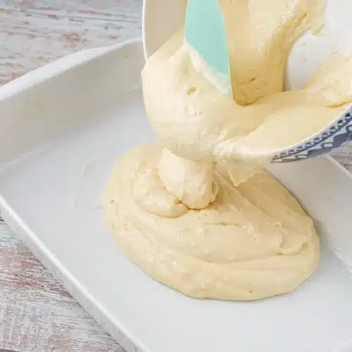 The last of the batter falling into the dish and spreading level
