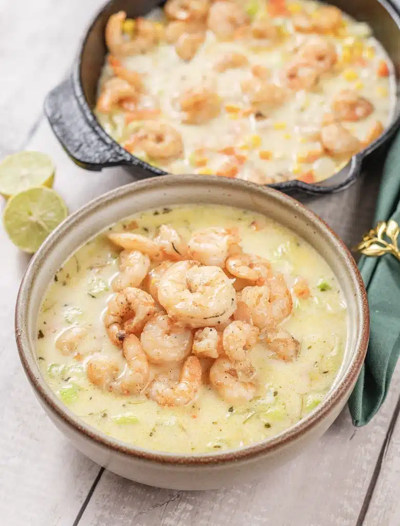 Shrimp chowder in a stoneware bowl seen from directly above