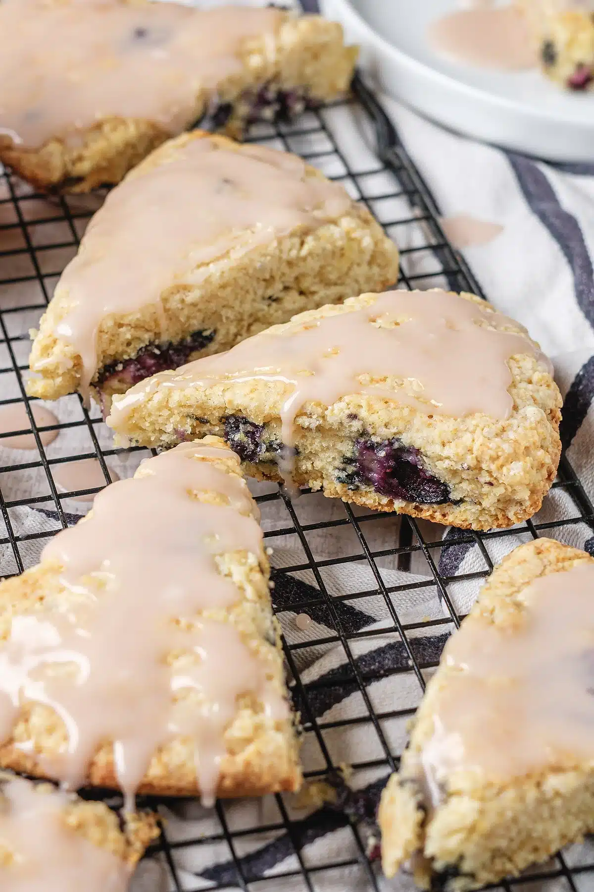 Blueberry scones broken open to show the berries and crumb
